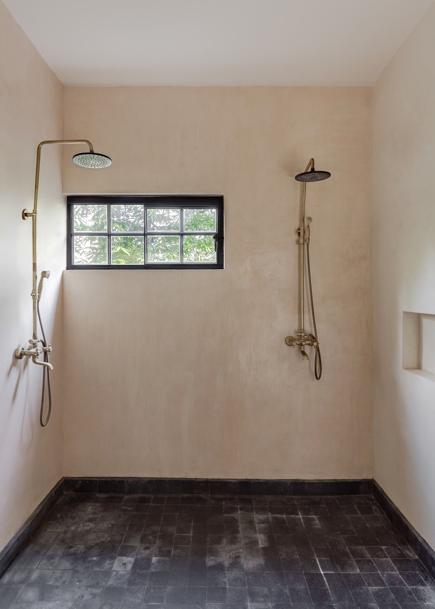 An outdoor shower open to the garden &mdash; a small luxury that becomes part of the daily ritual.
